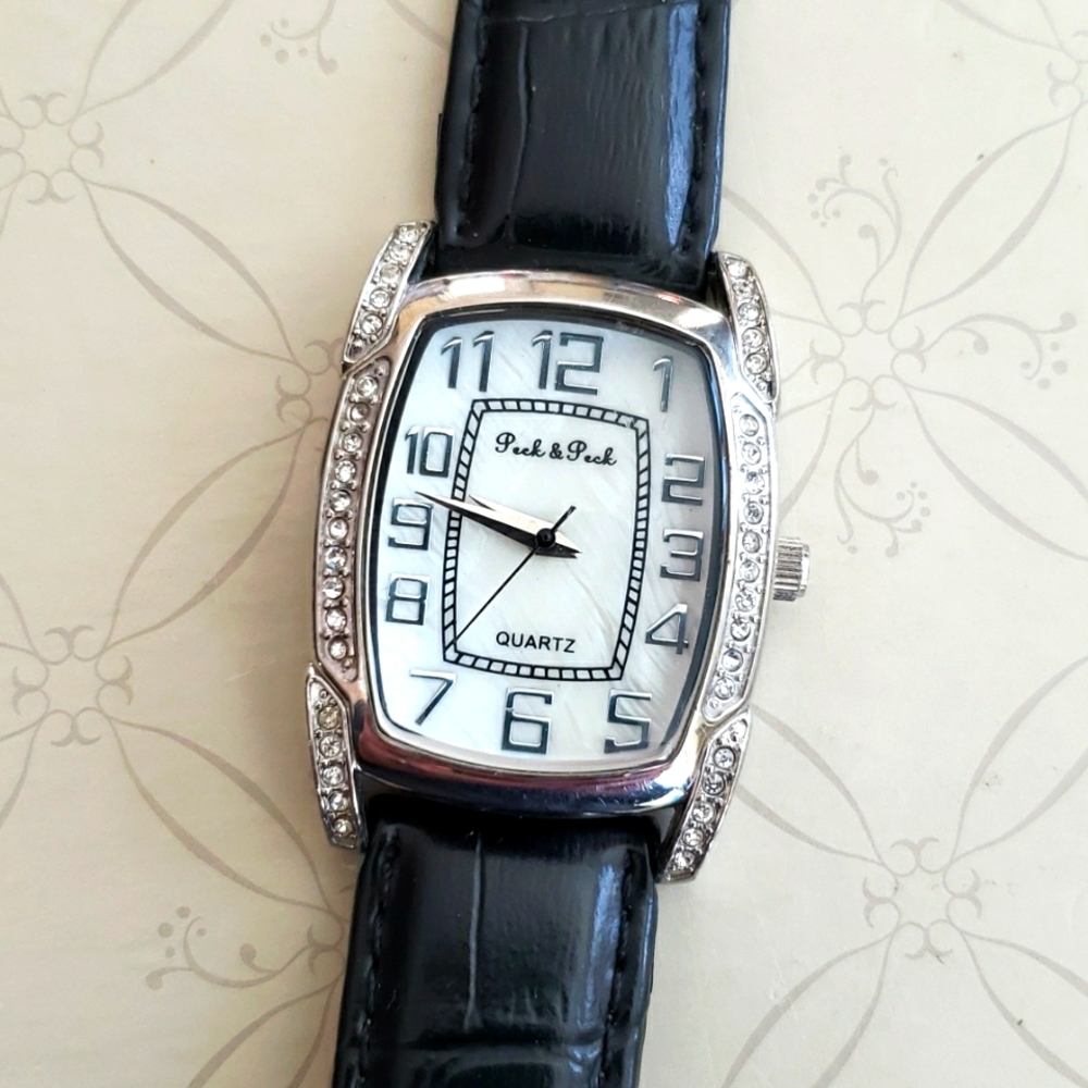 Peck and Peck watch with black leather wrist band